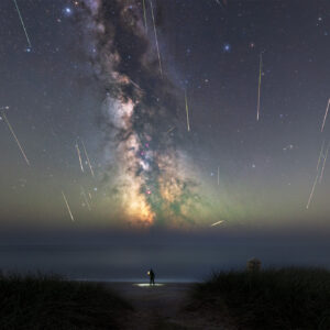 Perseid meteor shower over The Coombe Beach, County Wexford, with the Milky Way and multiple meteors visible above the Irish coastline on 12 August 2026.
