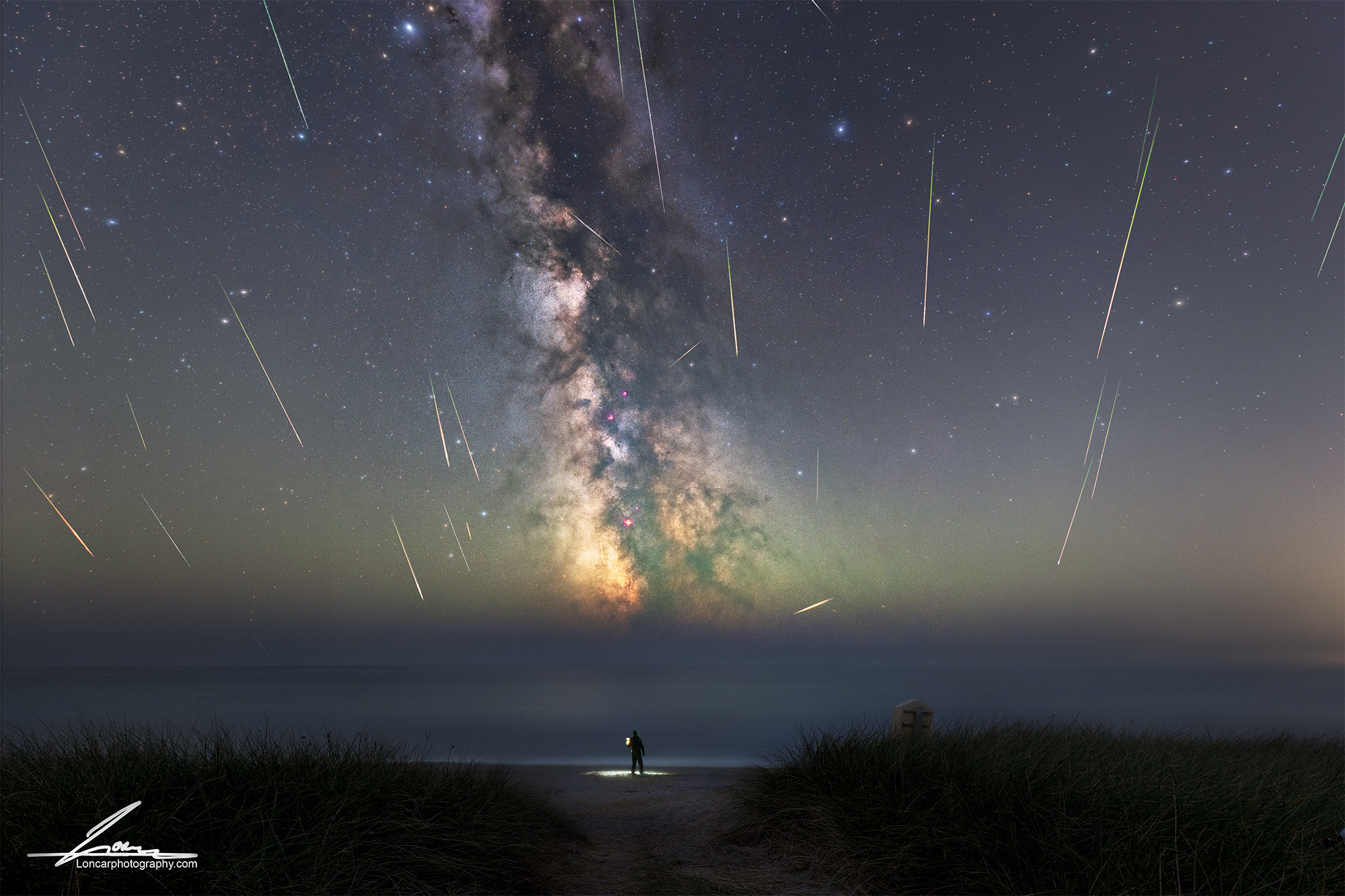 Perseid meteor shower over The Coombe Beach, County Wexford, with the Milky Way and multiple meteors visible above the Irish coastline on 12 August 2026.